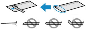 Image showing using a pen to flatten the leading edge of envelopes